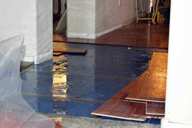 Professional Flood Cleanup technician working in Oakham, MA